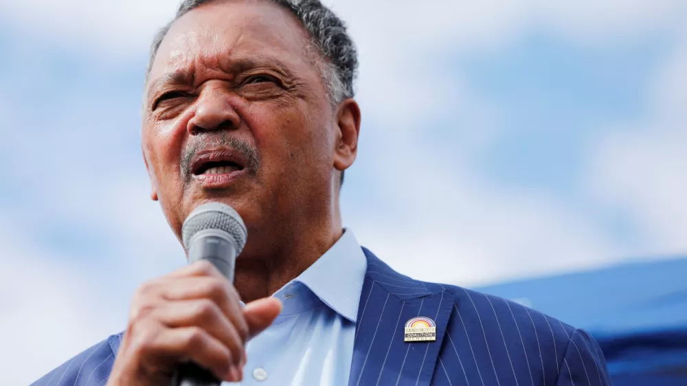 FILE PHOTO: Reverend Jesse Jackson speaks to protesters who gathered to memorialize George Floyd, who died in Minneapolis police custody, at the scene of his arrest in Minneapolis, Minnesota, U.S. June 4, 2020. REUTERS/Adam Bettcher/File Photo