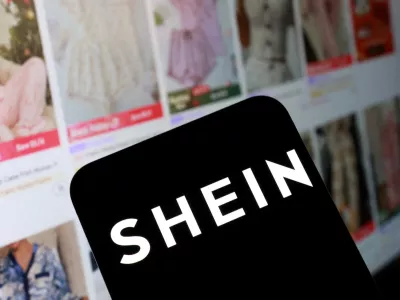 FILE PHOTO: Shein logo and their web page on smartphone in this illustration taken November 5, 2025. REUTERS/Dado Ruvic/Illustration/File Photo