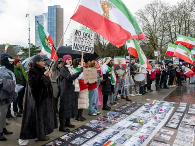 Iranian protesters hold placards and portraits as they demonstrate in front of United Nations office ahead of indirect nuclear talks between the United States and Iran in Geneva, Switzerland, Tuesday, Feb. 17, 2026. (Martial Trezzini/Keystone via AP)