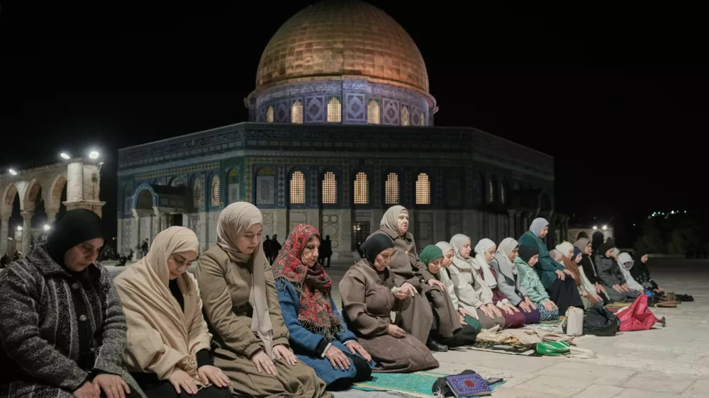 Muslim worshippers perform the evening Tarawih prayers during the holy fasting month of Ramadan, next to the Dome of Rock shrine at the Al-Aqsa Mosque compound in Jerusalem's Old City, Tuesday, Feb. 17, 2026. (AP Photo/Mahmoud Illean)