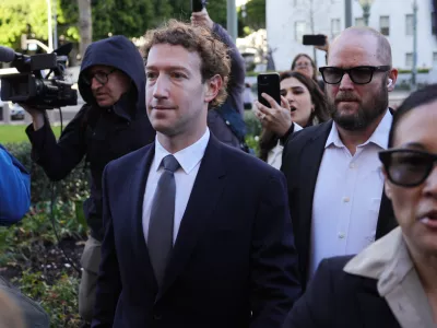 Meta CEO Mark Zuckerberg arrives for a landmark trial over whether social media platforms deliberately addict and harm children, Wednesday, Feb. 18, 2026, in Los Angeles. (AP Photo/Ryan Sun)