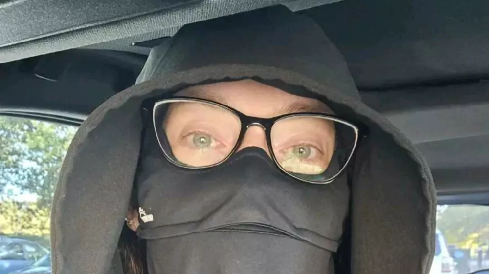 Story from Jam Press (Vampire Protects Skin)Pictured: Emily Richardson covering herself up from the sun.VIDEO: 'A MINUTE in the sun could kill me after ear infection medicine triggered rare syndrome'A woman calls herself a 'real-life vampire' after a rare reaction to medication left her unable to be in the sunlight for more than seconds.Emily Richardson has a rare condition called Stevens-Johnson Syndrome (SJS), which was triggered by various medications, including a common antibiotic, and "destroyed" her immune system.The result? She has become incredibly sensitive to the sun, and says being in direct exposure for even one minute would likely kill her, while just 30 seconds would land her in hospital.The 36-year-old's life has changed dramatically since the reaction became more severe and specific to sun exposure following a bout of Covid five years ago.Since, she has been forced to largely remain indoors, and leaving the home at nighttime involves a huge amount of planning."SJS attacks the mucosal membranes, specifically the areas that have been affected before, and it also spread," Emily, who is from Nashville, Tennessee, told NeedToKnow."It causes the top layer of skin to die and fall off."The longer the exposure, the worse the reaction."30 seconds of sun exposure will put me in the hospital &ndash; a minute would probably kill me."UV protection is the only way I can survive."Stevens-Johnson Syndrome is a rare, severe reaction, usually to medication or infection, causing flu-like symptoms followed by a painful, blistering rash that peels the top layer of skin and damages mucous membranes.Emily originally reacted to amoxicillin, a common penicillin antibiotic, prescribed to treat an ear infection.She reacted again to antibiotics for suspected bronchitis, triggering SJS again.But it wasn't until 2021 that things took a drastic turn for the worse, with Covid triggering the same response &ndash; but much worse, this time.The lasting effects have made Emily super sensitive to UV rays.She said: "Every [bout of] Stevens-Johnson Syndrome reaction broke my immune system down more to allow more reactions to occur."The doctors think Covid destroyed whatever was left of my immune system."I mostly try to stay home because leaving the house is just too difficult."It's not just the sun &ndash; I'll react to the UV rays from lightbulbs too."Even at night, I have to stay covered in public."To get by, Emily has to be carefully covered up at all times, often opting to wear black clothing to keep her skin concealed.In a recent video, the content creator shared information about the difference between wearing white or black fabric, and what it means for UV protection.She said: "The reason that black fabric absorbs more heat in the sunlight is because white fabric allows UV rays to go through the fabric and reach your skin."Whereas the black?"Black fabric is actually absorbing the UV rays and preventing them from reaching your skin."A lot of people ask me why I wear black clothing, because it's common knowledge that black fabric gets hotter in the sun, but with my extreme sun allergy, I learned very quickly that while black fabric does retain more heat, it actually keeps you safer in the sun."ENDSEDITOR'S NOTE:&nbsp;Video Usage Licence: (NON-EXCLUSIVE) We have obtained a non-exclusive licence from the copyright holder. A copy of the licence is available on request.Video Restrictions: None.,Image: 1066475240, License: Rights-managed, Restrictions: EDITOR'S NOTE:&nbsp;Video Usage Licence: (NON-EXCLUSIVE) We have obtained a non-exclusive licence from the copyright holder. A copy of the licence is available on request.Video Restrictions: None., Model Release: no