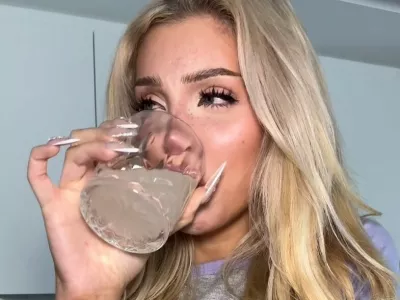 EXCLUSIVE: Story from Jam Press (Influencer Rib Broth)Pictured: A social media user comments on the video of Adea making and drinking broth made from her own removed ribs.VIDEO: Influencer makes bone broth with OWN RIBS removed in cosmetic procedureAn influencer made bone broth with the ribs she had removed in a cosmetic procedure &ndash; causing alarm and disbelief.Adea Danielle, known online as Adea, told how she had some ribs removed to achieve a tiny "wasp waist".The content creator, who has 1.7m TikTok fans, said she froze her removed ribs for six months before deciding to consume them in a broth.The unbelievable video showing her sampling soup made from her own bones went viral, with 16.8m views and 12,000 comments.Adea is first seen wearing a post-operative corset, which she says is part of her recovery process after the operation.She then holds up a bag of small bones while telling her fans: "Let's make some bone broth with my own ribs."I haven't opened this bag of ribs in six months."The influencer, who also speaks French and is based in Canada, is then seen boiling the bones and leaving them to simmer."After hours of cooling in the fridge, we have a highly concentrated bone broth," she says."Bone broth has a lot of vitamins and is really good for the gut health."After taking a sip, she adds: "This tastes like chicken."Shocked viewers could not believe their eyes.One fan said: "Please tell me it's not real!""Human ribs are bigger than that &ndash; those are ribs from an animal," added Hannah.Another fan remarked: "They're not pork ribs, they're hers, she even said so herself in the video."After the footage went viral, medical specialists warned about the risks associated with this type of surgery.Dr. Manuel G&oacute;mez Villar said: "The ribs protect vital organs such as the heart, lungs, and kidneys &ndash; and along with the intercostal muscles, they are essential for breathing and lung capacity."It's a very difficult surgery to perform precisely bec.11 Feb 2026Pictured: Story from Jam Press (Influencer Rib Broth)Pictured: A video grab of Adea making and drinking broth made from her own removed ribs.VIDEO: Influencer makes bone broth with OWN RIBS removed in cosmetic procedureAn influencer made bone broth with the ribs she had removed in a cosmetic procedure &ndash; causing alarm and disbelief.Adea Danielle, known online as Adea, told how she had some ribs removed to achieve a tiny "wasp waist".The content creator, who has 1.7m TikTok fans, said she froze her removed ribs for six months before deciding to consume them in a broth.The unbelievable video showing her sampling soup made from her own bones went viral, with 16.8m views and 12,000 comments.Adea is first seen wearing a post-operative corset, which she says is part of her recovery process after the operation.She then holds up a bag of small bones while telling her fans: "Let's make some bone broth with my own ribs."I haven't opened this bag of ribs in six months."The influencer, wh.,Image: 1074039477, License: Rights-managed, Restrictions: NO Australia, Germany, Norway, South Korea, Sweden, United Kingdom, United States, Unknown Country, Model Release: no