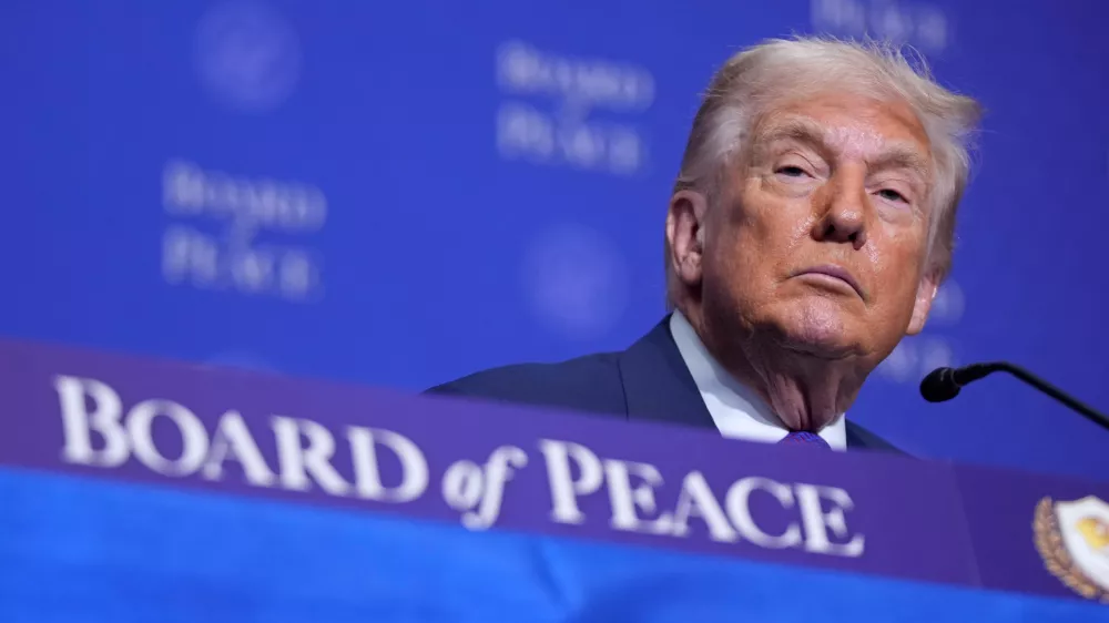 President Donald Trumpl listens during a Board of Peace meeting at the U.S. Institute of Peace, Thursday, Feb. 19, 2026, in Washington. (AP Photo/Mark Schiefelbein)