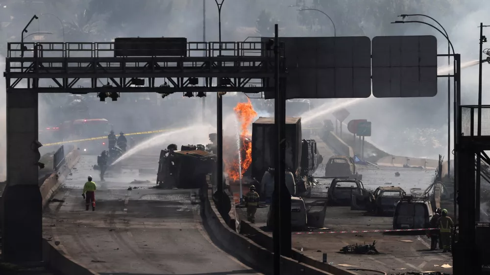 Firefighters work at the site of a deadly explosion, according to local media, in Santiago, Chile, February 19, 2026. REUTERS/Pablo Sanhueza
