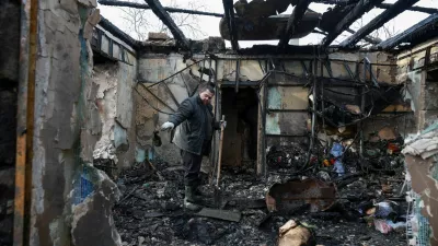 A resident removes debris from his house, which was hit by a Russian drone strike, amid Russia's attack on Ukraine, in Odesa, Ukraine February 21, 2026. REUTERS/Nina Liashonok   TPX IMAGES OF THE DAY