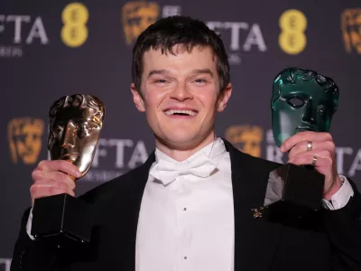 Robert Aramayo poses with the EE rising star award and the award for leading actor for 'I Swear' at the 79th British Academy Film Awards, BAFTA's, in London, Sunday, Feb. 22, 2026. (AP Photo/Alastair Grant)