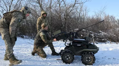 In this photo provided by Ukraine's 65th Mechanized Brigade press service, soldiers test land drones in Zaporizhzhia region, Ukraine, Monday, Jan. 26, 2026. (Andriy Andriyenko/Ukraine's 65th Mechanized Brigade via AP)