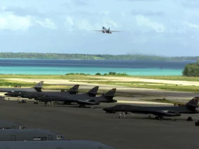B-1 accelerates for take off (background), during Operation Enduring Freedom. United States Air Force photograph by: SrA Rebeca M. Luquin.