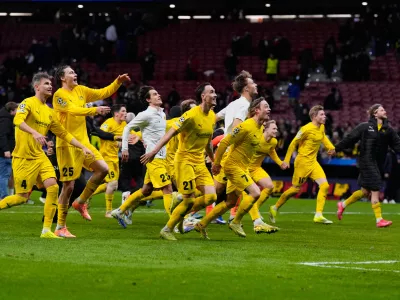 Bodo Glimt players celebrate at the end of the Champions League opening phase soccer match between Atletico Madrid and Bodo Glimt in Madrid, Spain, Wednesday, Jan. 28, 2026. (AP Photo/Manu Fernandez)