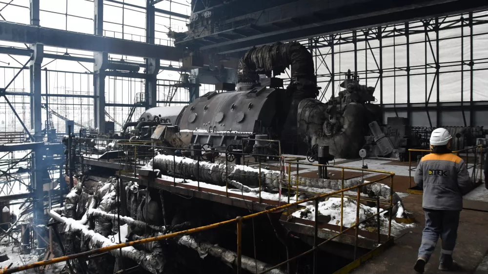 Workers repair the destroyed DTEK company's power plant after a recent Russian missile attack on the country's energy system in an undisclosed location in Ukraine Friday, Jan. 23, 2026. (AP Photo/Mykola Tys)