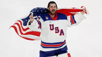 Milano Cortina 2026 Olympics - Ice Hockey - Men's Gold Medal Game - Canada vs United States - Milano Santagiulia Ice Hockey Arena, Milan, Italy - February 22, 2026. Connor Hellebuyck of United States celebrates with his national flag after winning gold REUTERS/David W Cerny   TPX IMAGES OF THE DAY