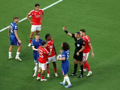 Soccer Football - FIFA Club World Cup - Round of 16 - Benfica v Chelsea - Bank of America Stadium, Charlotte, North Carolina, U.S. - June 28, 2025 Benfica's Gianluca Prestianni is shown a red card by referee Slavko Vincic REUTERS/Mike Segar