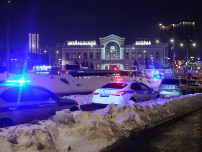 Police and emergency services are seen at the scene of an attack on a police patrol near the Savyolovsky Railway Station, in Moscow, Tuesday, Feb. 24, 2026. (AP Photo)