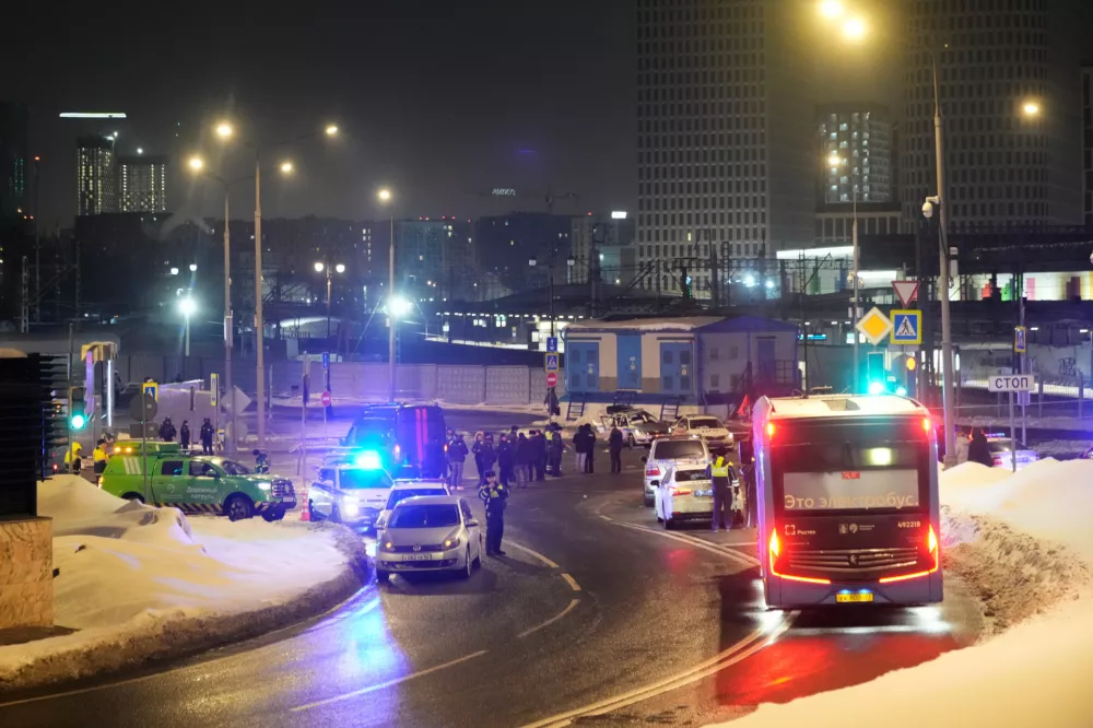 Police and emergency services are seen at the scene of an attack on a police patrol near the Savyolovsky Railway Station, in Moscow, Tuesday, Feb. 24, 2026. (AP Photo)