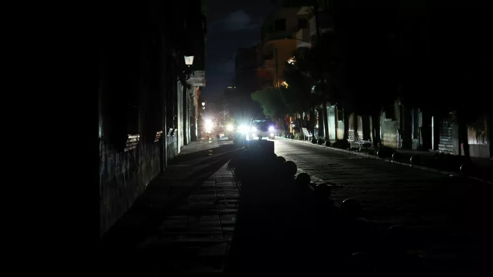 Vehicles go by on the streets in the Colonial Zone during a nationwide blackout caused by a major failure in the national power grid, in Santo Domingo, Dominican Republic, February 23, 2026. REUTERS/Erika Santelices