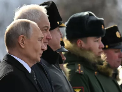 Russia's President Vladimir Putin and Defence Minister Andrei Belousov attend a wreath laying ceremony marking Defender of the Fatherland Day at the Tomb of the Unknown Soldier by the Kremlin Wall in Moscow, Russia, February 23, 2026. Sputnik/Yuri Kochetkov/Pool via REUTERS ATTENTION EDITORS - THIS IMAGE WAS PROVIDED BY A THIRD PARTY.