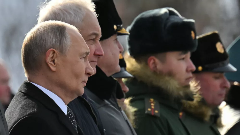Russia's President Vladimir Putin and Defence Minister Andrei Belousov attend a wreath laying ceremony marking Defender of the Fatherland Day at the Tomb of the Unknown Soldier by the Kremlin Wall in Moscow, Russia, February 23, 2026. Sputnik/Yuri Kochetkov/Pool via REUTERS ATTENTION EDITORS - THIS IMAGE WAS PROVIDED BY A THIRD PARTY.