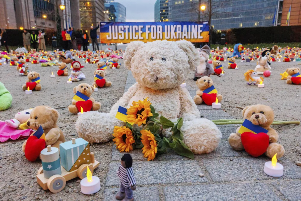 IMAGE DISTRIBUTED FOR AVAAZ.ORG - Avaaz members and Ukrainian refugees install thousands of kids' teddy bears and toys at Schuman Roundabout in front of the European Commission to highlight the reported abduction of thousands of Ukrainian children by Russia on Thursday Feb,23, 2022 in Brussels. Attendants call on EU, US, UK and Canadian leaders to sanction 14 Russian officials who are among those allegedly responsible for the abductions. (Olivier Matthys/AP Images for Avaaz.org)