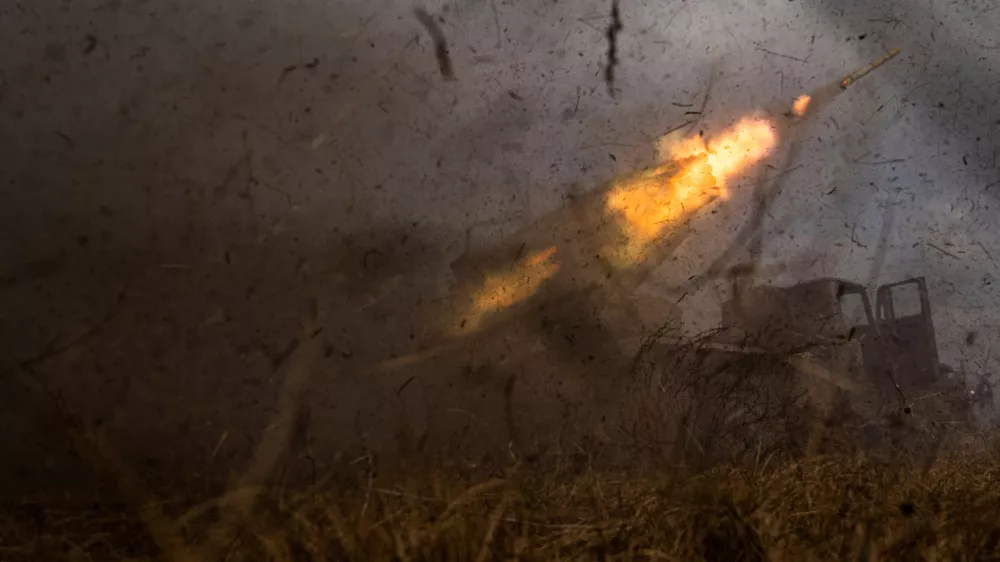 FILE - A Ukrainian MSLR BM-21 "Grad" rocket launcher of the 95 Air Assault brigade fires towards Russian positions at the frontline near Kreminna, Ukraine, Thursday, March 9, 2023. (AP Photo/Evgeniy Maloletka, File)