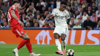Soccer Football - UEFA Champions League - Play Off - Second Leg - Real Madrid v Benfica - Santiago Bernabeu, Madrid, Spain - February 25, 2026 Real Madrid's Vinicius Junior scores their second goal REUTERS/Violeta Santos Moura