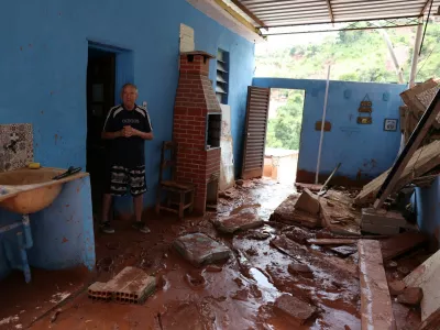 Jose Florencio Torres, 69, stands next to debris of his damaged house, following heavy rains that killed residents and left missing people, in Juiz de Fora, Minas Gerais state, Brazil, February 25, 2026. REUTERS/Pilar Olivares