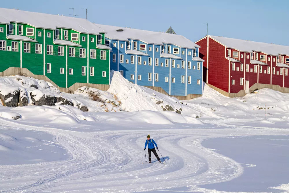 A person skis in Nuuk, Greenland, Friday, Feb. 6, 2026. (Christinne Muschi /The Canadian Press via AP)