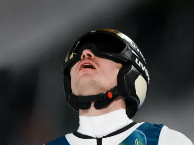 Milano Cortina 2026 Olympics - Ski Jumping - Men's Super Team - Predazzo Ski Jumping Stadium, Predazzo, Italy - February 16, 2026. Anze Lanisek of Slovenia reacts after the final round REUTERS/Stephanie Lecocq