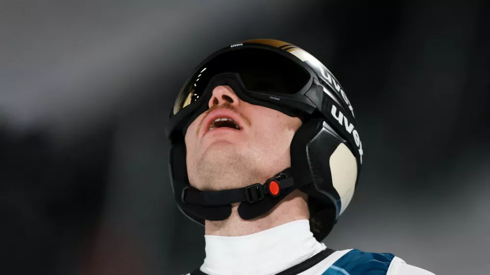 Milano Cortina 2026 Olympics - Ski Jumping - Men's Super Team - Predazzo Ski Jumping Stadium, Predazzo, Italy - February 16, 2026. Anze Lanisek of Slovenia reacts after the final round REUTERS/Stephanie Lecocq