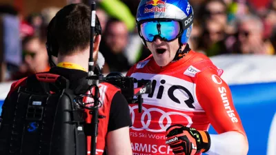 Switzerland's Marco Odermatt reacts at the finish area, during a men's World Cup downhill race, in Garmisch Partenkirchen, Germany, Saturday, Feb. 28, 2026. (AP Photo/Giovanni Auletta)