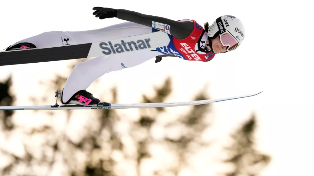FILE - Nika Prevc, of Slovenia, soars through the air during her first round jump of the ski jumping women's large hill individual competition at the Nordic World Ski Championships in Trondheim, Norway, March 7, 2025. (AP Photo/Matthias Schrader, File)