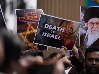 A Shiite Muslims holds a photograph of Iran's Supreme Leader Ayatollah Ali Khamenei during a protest against the U.S. and Israel in Hyderabad, India, Sunday, March 1, 2026. (AP Photo/Mahesh Kumar A.)