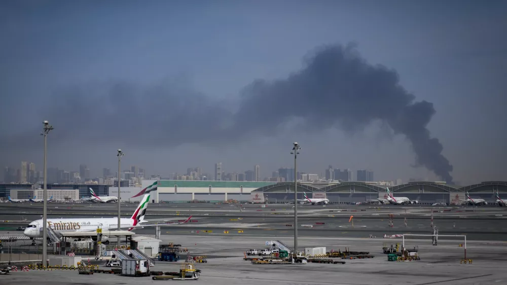 Emirates airplanes are parked at the Dubai International Airport after its closure in Dubai, United Arab Emirates, Sunday, March 1, 2026. (AP Photo/Altaf Qadri)