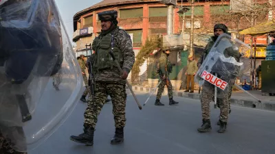Indian paramilitary soldiers patrol as authorities impose restrictions after protests erupted against the killing of Iran's Supreme Leader Ayatollah Ali Khamenei, in Srinagar, Indian controlled Kashmir Monday, March 2, 2026. (AP Photo/Mukhtar Khan)