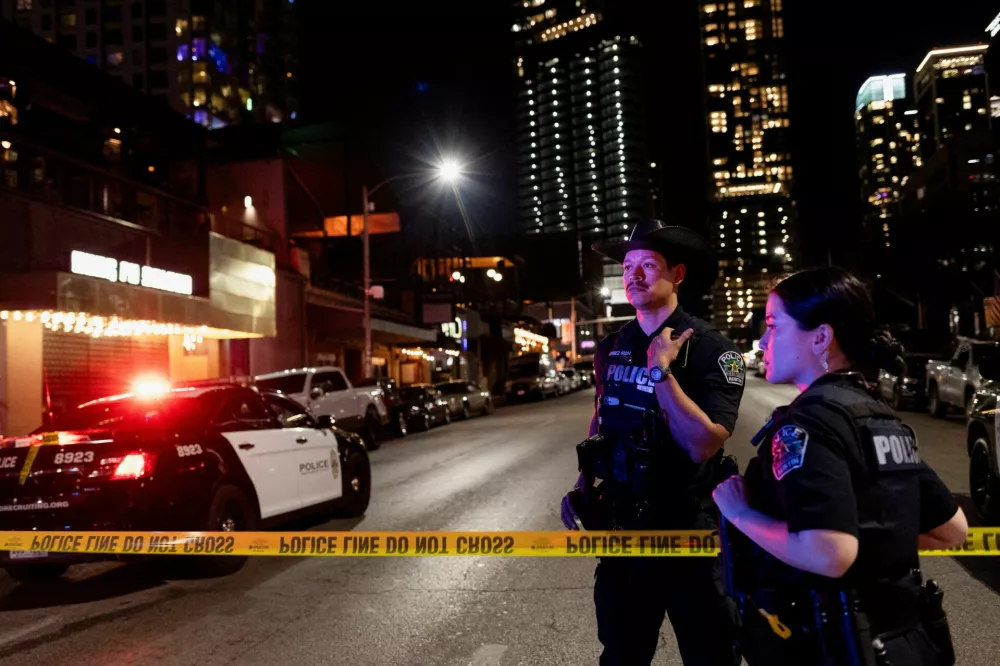 Austin police officers work at the scene after a deadly mass shooting outside Buford's, a popular roadhouse-style bar in Austin, Texas, U.S. March 1, 2026. REUTERS/Nuri Vallbona
