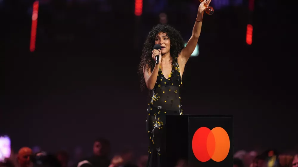 Olivia Dean wins the Pop Act award during the Brit Awards 2026 in Manchester, England, Saturday, Feb. 28, 2026. (Photo by Scott A Garfitt/Invision/AP)