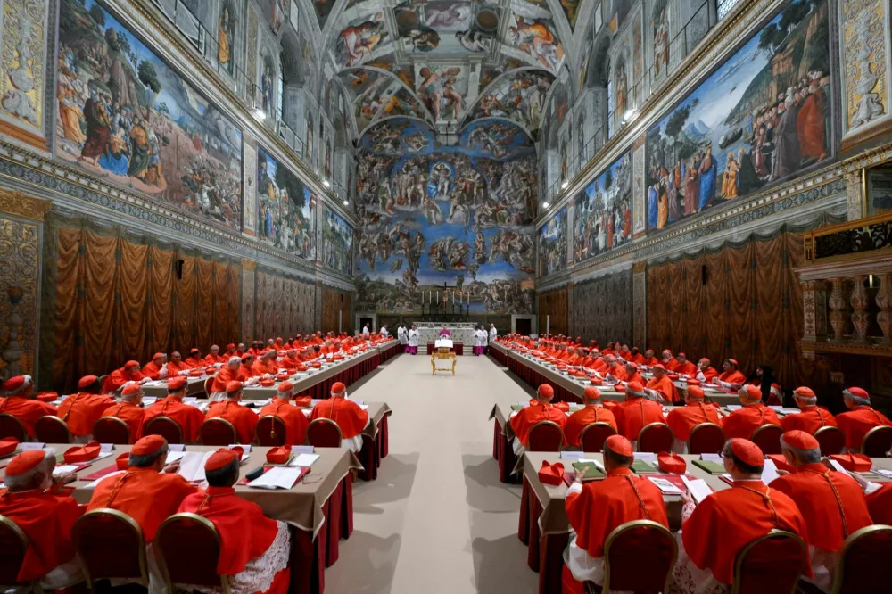 Cardinals pray in the Sistine Chapel, ahead of the conclave to elect the next pope at the Vatican, May 7, 2025. Vatican Media/Handout via REUTERS  THIS IMAGE HAS BEEN SUPPLIED BY A THIRD PARTY   TPX IMAGES OF THE DAY