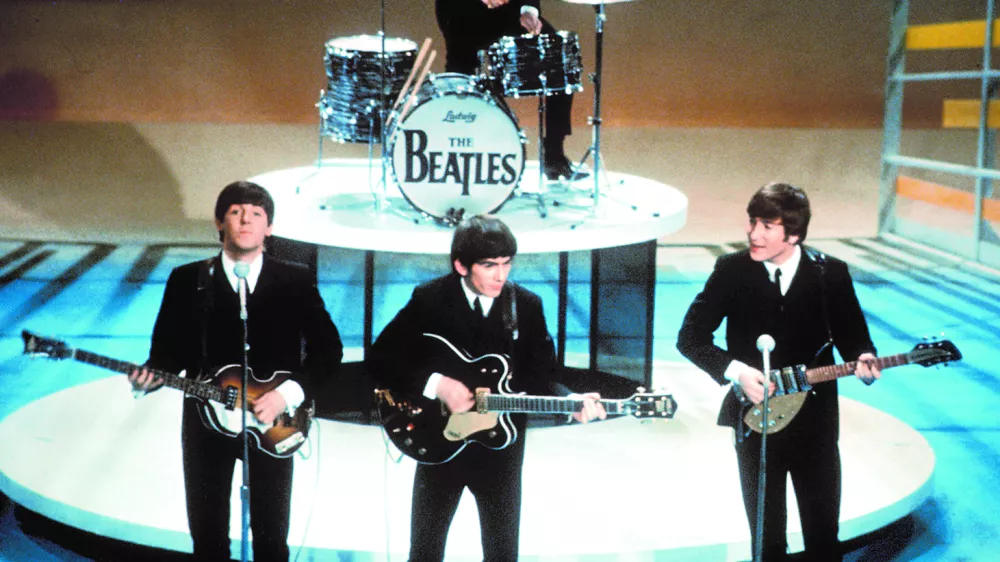 ** FILE **The Beatles perform on the CBS "Ed Sullivan Show" in New York, in this Feb. 9, 1964, file photo. From left, front, are Paul McCartney, George Harrison and John Lennon. Ringo Starr plays drums in the background. The Beatles' "Love" album is being released on Nov. 21, and is a thorough reinterpretation of their work. (AP Photo/FILE)------4 k