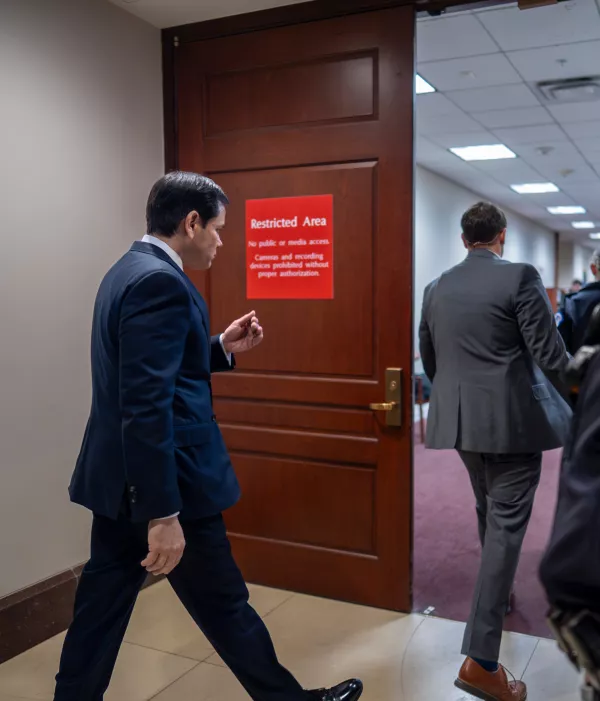 Secretary of State Marco Rubio, left, enters a secure room in the basement of the Capitol to give a classified intelligence briefing to top lawmakers on U.S. attacks in Iran, in Washington, Monday, Mar. 2, 2026. (AP Photo/J. Scott Applewhite)