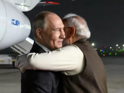 Russian President Vladimir Putin, left, and Indian Prime Minister Narendra Modi embrace each other at the Palam Air Base in New Delhi, India, Thursday, Dec. 4, 2025. (Grigory Sysoyev, Sputnik, Kremlin Pool Photo via AP)