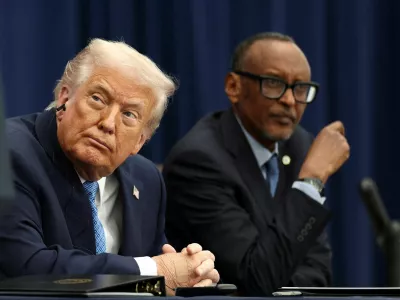 FILE PHOTO: U.S. President Donald Trump listens to President of the Democratic Republic of the Congo Felix Tshisekedi (not pictured) speak during a signing ceremony with President of Rwanda Paul Kagame at the U.S. Institute of Peace in Washington, D.C., U.S., December 4, 2025. REUTERS/Kevin Lamarque/File Photo