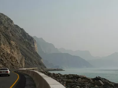 A car rides along the coast of Musandam overlooking the Strait of Hormuz amid the U.S.-Israeli conflict with Iran, Oman, March 2, 2026.REUTERS/Amr Alfiky   TPX IMAGES OF THE DAY