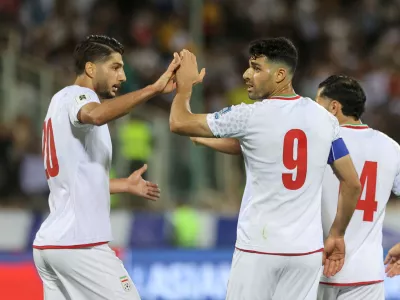 FILE PHOTO: Soccer Football - World Cup - Asian Qualifiers - Group A - Iran v North Korea - Azadi Stadium, Tehran, Iran - June 10, 2025 Iran's Mehdi Taremi celebrates scoring their second goal with Mohammad Mohebi Majid Asgaripour/WANA (West Asia News Agency) via REUTERS  ATTENTION EDITORS - THIS IMAGE HAS BEEN SUPPLIED BY A THIRD PARTY./File Photo