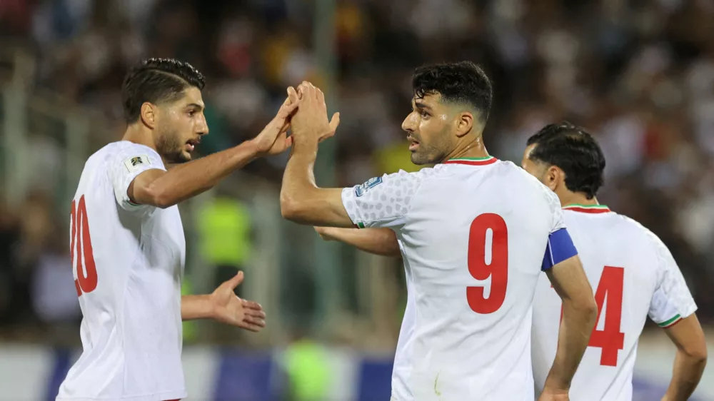 FILE PHOTO: Soccer Football - World Cup - Asian Qualifiers - Group A - Iran v North Korea - Azadi Stadium, Tehran, Iran - June 10, 2025 Iran's Mehdi Taremi celebrates scoring their second goal with Mohammad Mohebi Majid Asgaripour/WANA (West Asia News Agency) via REUTERS  ATTENTION EDITORS - THIS IMAGE HAS BEEN SUPPLIED BY A THIRD PARTY./File Photo
