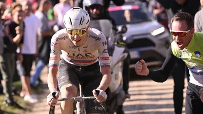 Slovenia's Tadej Pogacar competes during the men's Strade Bianche' (White Roads) cycling race from and to Siena, Italy, Saturday, March 2, 2024. (Fabio Ferrari/LaPresse via AP)