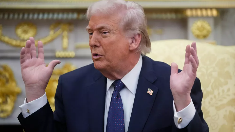 President Donald Trump speaks during a meeting with German Chancellor Friedrich Merz in the Oval Office at the White House, Tuesday, March 3, 2026, in Washington. (AP Photo/Mark Schiefelbein)
