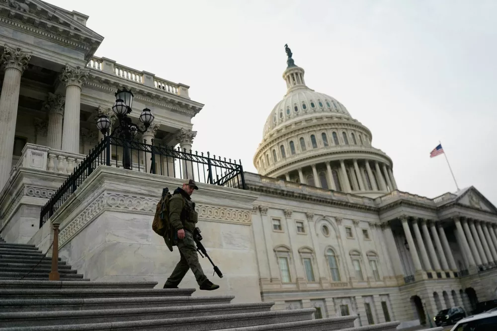 A member of the U.S. Capitol police patrols following a vote in the U.S. House of Representatives on a bipartisan war powers resolution aiming to stop the military campaign against Iran, on Capitol Hill, in Washington, D.C., U.S., March 5, 2026. REUTERS/Nathan Howard