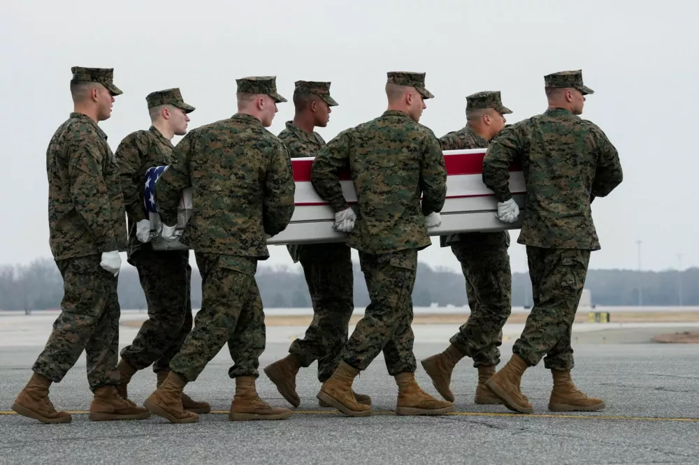 Members of the military carry a transfer case during a dignified transfer of the remains of U.S. Marine Corps Lance Corporal Kevin Melendez of Fort Worth in Texas, who died in Jeddah, Saudi Arabia in a nonhostile incident, at Dover Air Force Base in Dover, Delaware, U.S., March 4, 2026. REUTERS/Ken Cedeno    TPX IMAGES OF THE DAY
