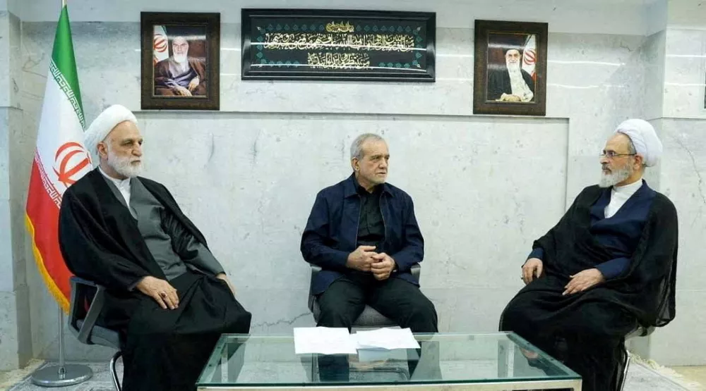 FILE PHOTO: Iranian President Masoud Pezeshkian, Gholam-Hossein Mohseni-Eje'i, the head of the judiciary and Alireza Arafi, deputy chairman of the Assembly of Experts, attend the meeting of the interim leadership council of Iran in an unknown location, amid the U.S.-Israel conflict with Iran, in Iran, March 1, 2026. IRIB/WANA (West Asia News Agency)/Handout via REUTERS ATTENTION EDITORS - THIS PICTURE WAS PROVIDED BY A THIRD PARTY  REFILE - ADDED CONTEXT/File Photo