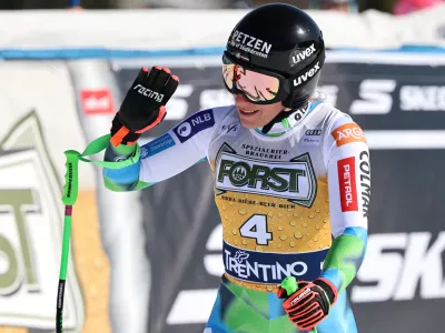 Slovenia's Ilka Stuhec at the finish area of an alpine ski, women's World Cup downhill, in Val di Fassa, Italy, Saturday, March 7, 2026. (AP Photo/Marco Trovati)
